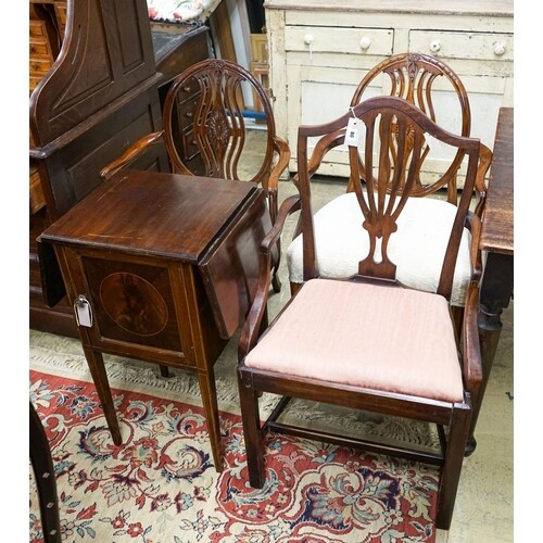 A pair of Hepplewhite style elbow chairs with oval backs, on...
