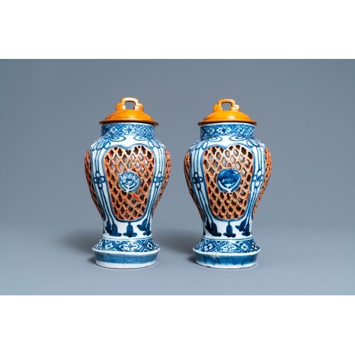 A pair of Japanese Arita blue and white reticulated vases, E...