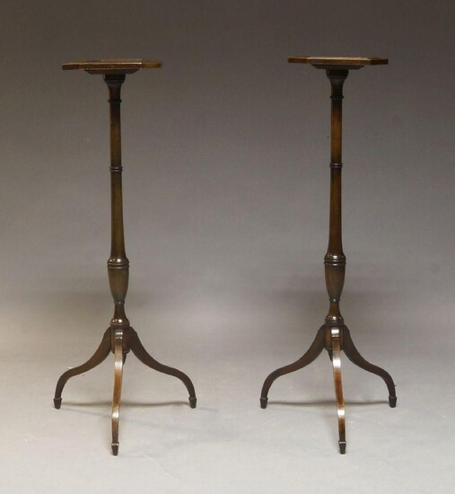 A pair of Regency mahogany jardiniÃ¨re stands, with octagonal shelf on turned baluster form support to down swept legs with spade feet,108cm high (2)