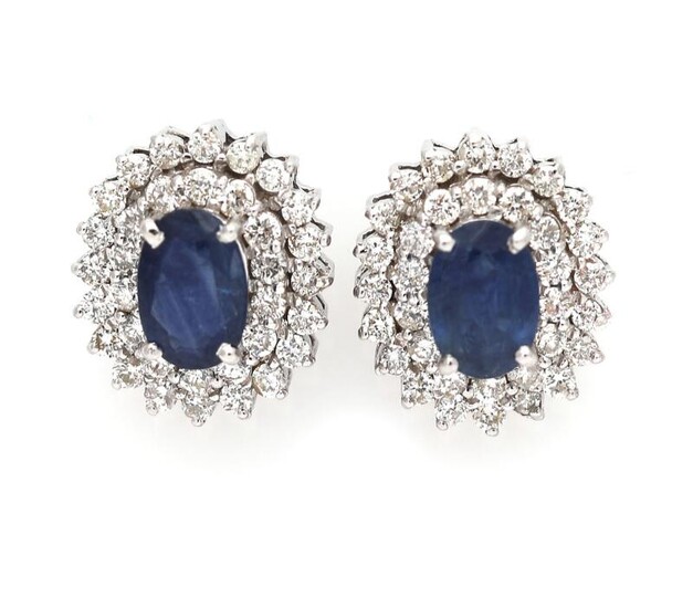 SOLD. A pair of ear studs each set with a sapphire encircled by numerous diamonds, mounted in 14k white gold. (2) – Bruun Rasmussen Auctioneers of Fine Art