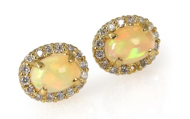 A pair of opal and diamond ear studs each set with an...