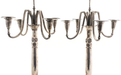 A pair of rare and unique "Schneider" silver candelabras,...