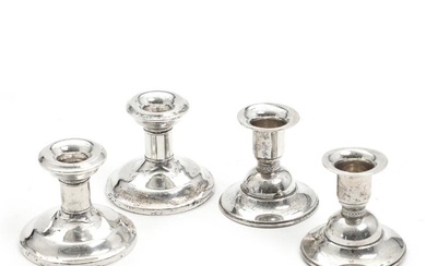 A pair of sterling silver candlesticks. Made by John & William Deakin,...