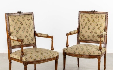 A pair of wood-sculptured armchairs with emboidered upholstry. Louis XVI style. (L:62 x W:64 x H:100