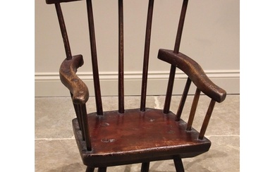 A primitive stained ash comb back chair, probably West Count...