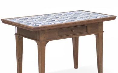 SOLD. A rectangular Danish oakwood coffee table. First half of the 20th century. 28 Dutch faience tiles; ca. 1800. H. 61 cm. L. 96 cm. D. 55 cm. – Bruun Rasmussen Auctioneers of Fine Art