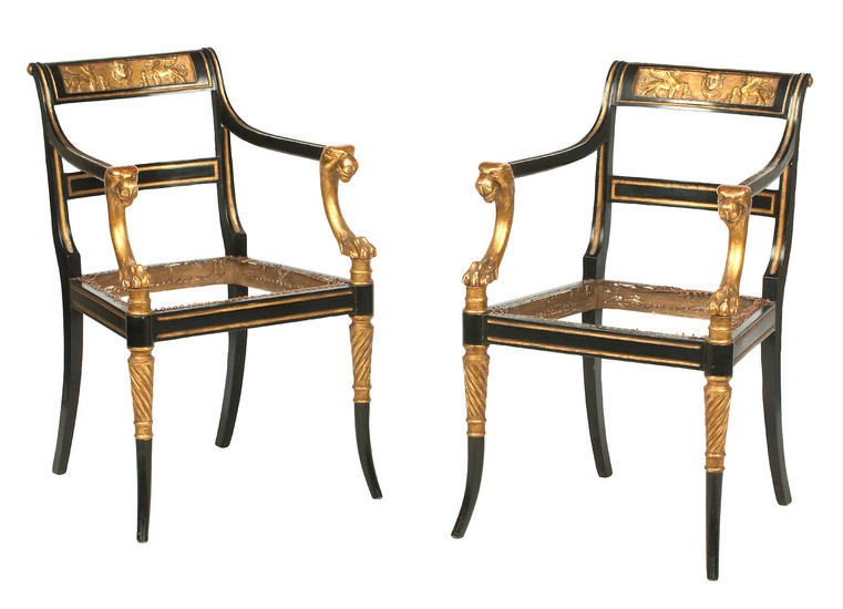 A set of four 19th century ebonised and parcel gilt open armchairs, After a design by George Smith