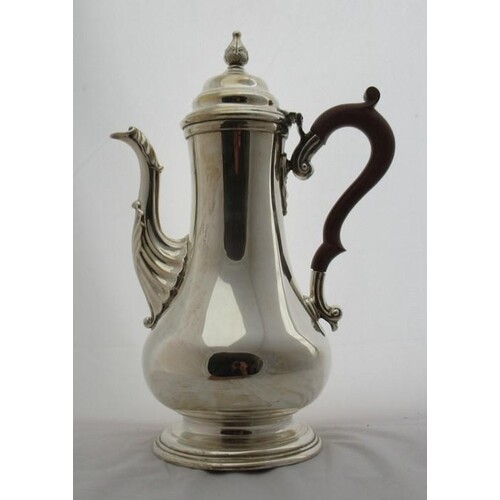 A silver coffee pot, of baluster form, with leaf moulding to...