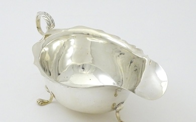 A silver sauce boat hallmarked Chester 1905, maker George Na...