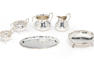 A sterling silver sugar bowl and creamer; a small tray L. 20.5...