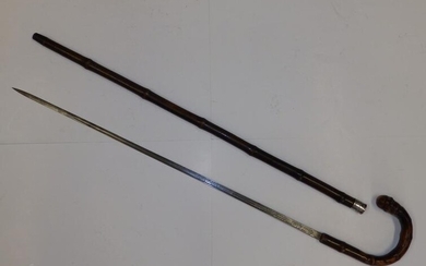 A sword stick with silver collar and Wilkinson blade....