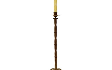 A wrought iron candle stand. 20th century, with a twisted sq...