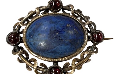 A yellow metal brooch set with central lapis lazuli and...