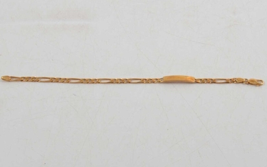 A yellow metal identity bracelet marked Italy 750.