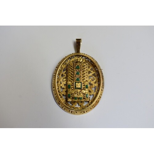 A yellow metal oval pendant, decorated Aztec sun god, set 10...