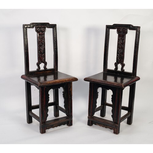 AGED PAIR OF CHINESE CARVED HARDWOOD SINGLE CHAIRS, each wit...