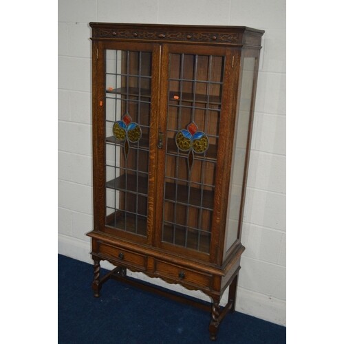 AN EARLY TO MID 20TH CENTURY OAK DOUBLE DOOR BOOKCASE, with ...