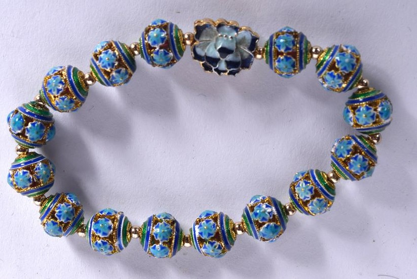 AN ENAMEL BRACELET, formed with floral decorated beads.