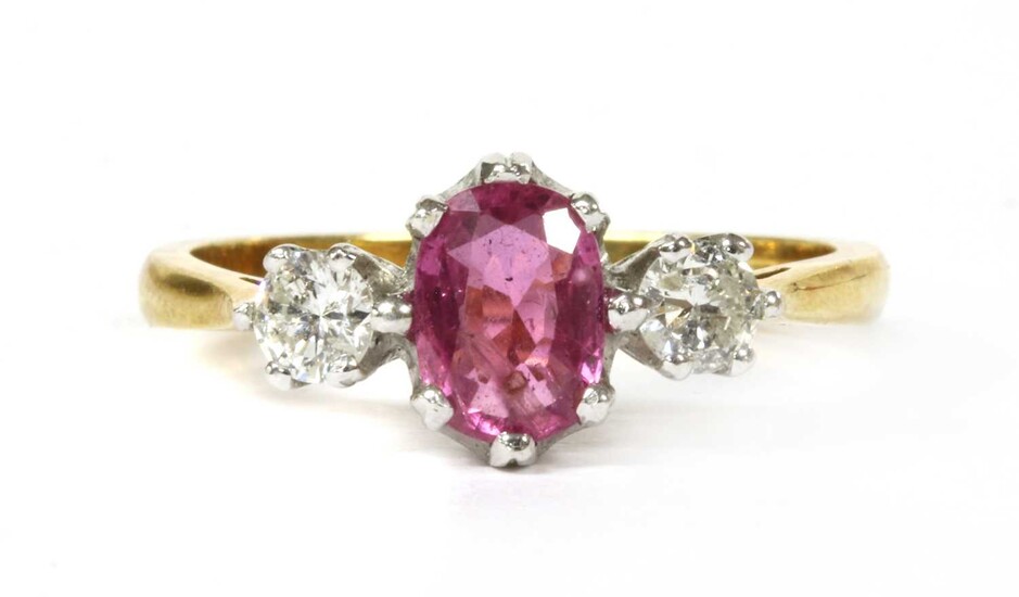 An 18ct gold pink sapphire and diamond three stone ring