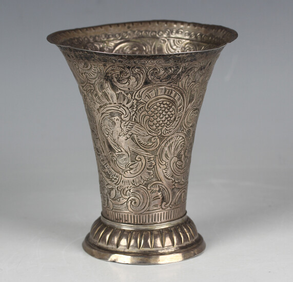 An 18th century Continental silver beaker, possibly Scandinavian, of flared form, embossed with bird