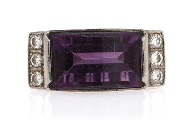 SOLD. An amethyst and diamond ring set with a fancy-cut amethyst flanked by numerous brilliant-cut...
