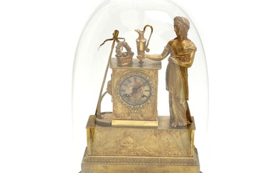 An early 19th century French partly gilt bronze mantle clock, decorated with...