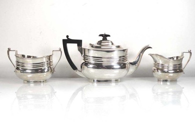 An early 20th century silver three piece tea service of...