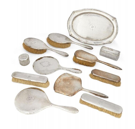 An eight piece silver-backed vanity set, comprising...