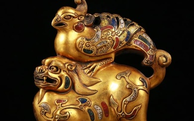 An exquisite gilt bronze ornament inlaid with gems of auspicious animals