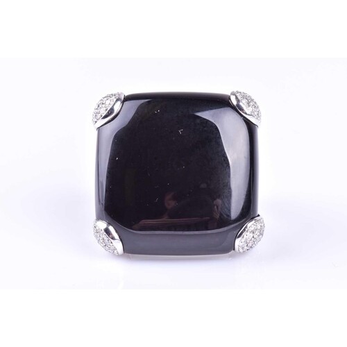 An onyx and diamond dress ring by Gavello, the cushion shape...