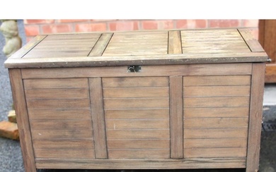 An outdoor teak storage chest, of slatted form with a hinged...