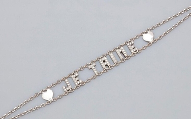 Bracelet in white gold, 750 MM, openwork, drawing the diamond letters "je t'aime", length 17 cm, width 0.90 cm, clasp snap hook, weight: 10.4gr. gross.