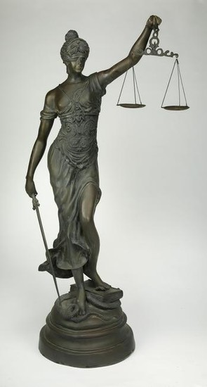 Bronze sculpture of Lady Justice holding her scales