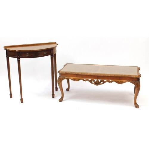 Carved walnut coffee table with glass top and a demi lune ha...