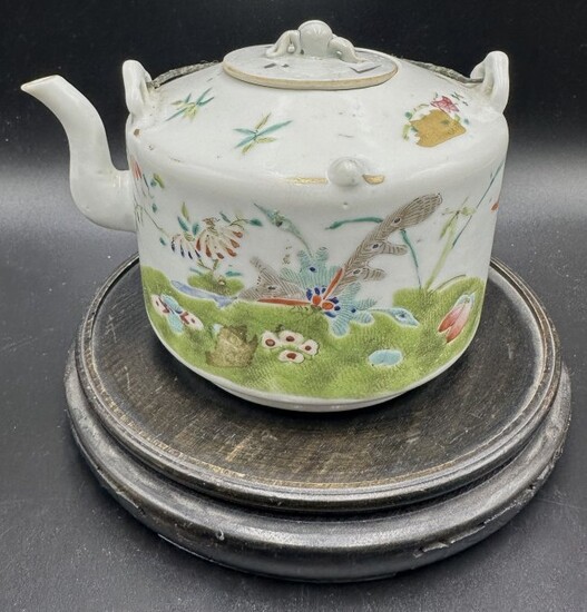 Chinese porcelain teapot with butterfly