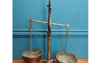 Early 20th C. brass and cast iron shop scales. {54 cm H x 43...