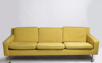 GREEN UPHOLSTERED THREE SEATER SOFA.