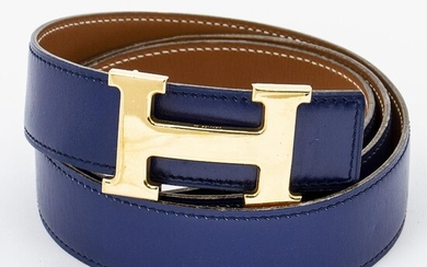 SOLD. Hermès: A belt made of dark blue and brown leather with a gold toned H buckle. Size 100. – Bruun Rasmussen Auctioneers of Fine Art