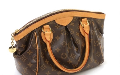 SOLD. Louis Vuitton: A "Tivoli PM" bag made of brown monogram canvas with brown leather...