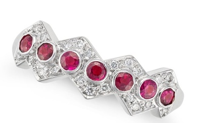 NO RESERVE - A RUBY AND DIAMOND RING in 18ct white gold, set with a row of round cut rubies accented