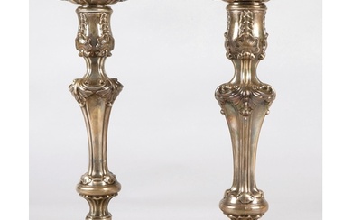 Pair of ornate Georgian silver weighted candlesticks , assay...