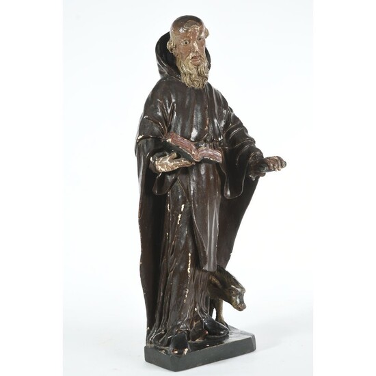 SUJET en bois sculpté représentant Saint-Antoine à belle polychromie ancienne. (Quelques usures). Aux pieds son...