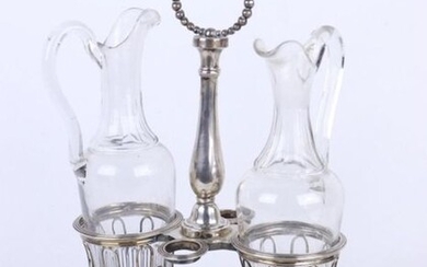 Silver oil and vinegar maker, the baluster handle grip with falling pearls.