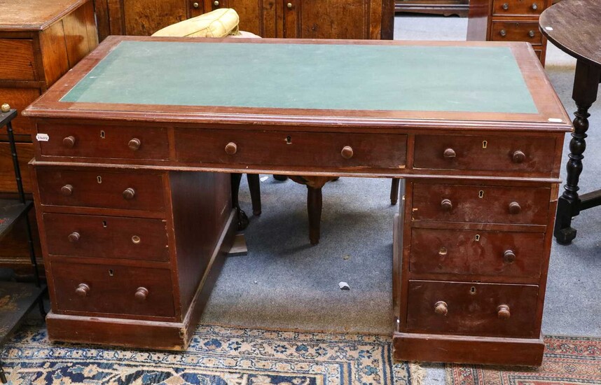 An early 20th century mahogany twin pedestal desk with...