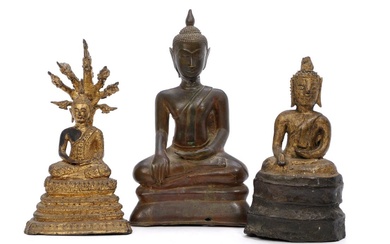 Three bronze Buddha figures of which two gilt, seaited in meditative positions,...