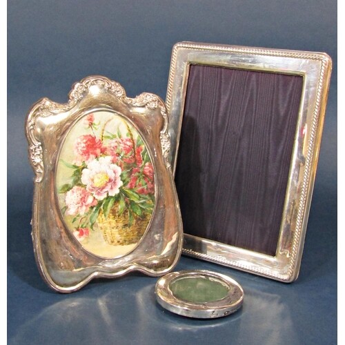 Three silver frames to include a larger rectangular easel fr...