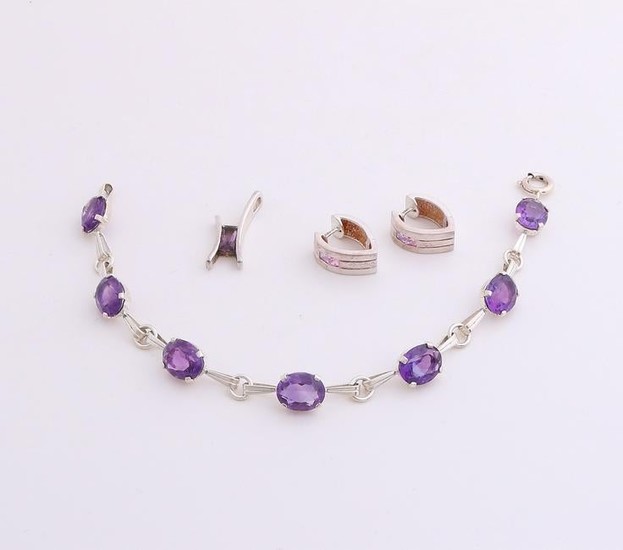 Three silver jewelry with colored stones. A bracelet