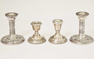 Two pairs of Elizabeth II silver candlesticks