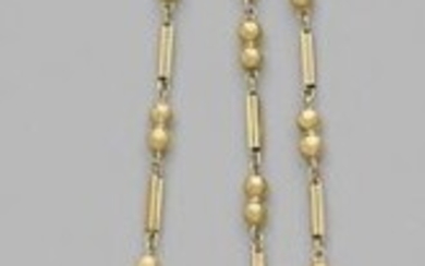 Yellow gold castelaine decorated with two oval motifs...