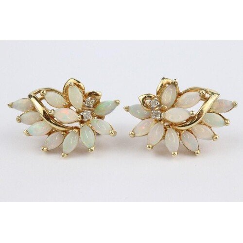 14ct gold opal and diamond earrings. The earrings set with e...